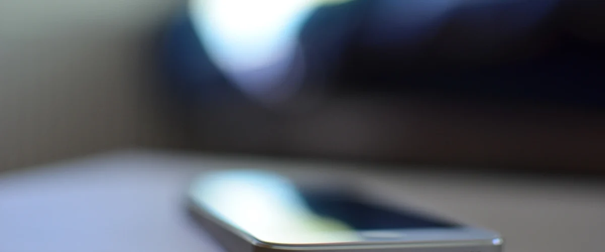 a phone out-of-focus resting on a table